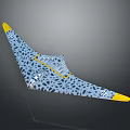 Triangle Wing Airplane With Blue Gray Body Black Spots And Yellow Wing Tips Design