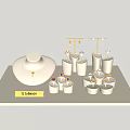 Elegant Various Jewelry Display With Necklace Earrings Rings On White Stand