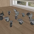 Different Types of Caster Wheels Displayed on Wooden Table with Natural Light