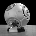 Modern Tech Inspired Spherical Silver White Sculpture With Black Circular Accents And Metallic Base