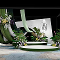 Modern Garden Landscape Design With Green Plants Flowers White Backdrop And Black Letter Decoration