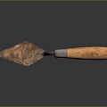 Rusty Trowel With Metal Blade And Wooden Handle On Dark Background With Reflection