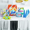 Organized Washing Machine Space With Laundry Supplies Hanging Clothes And Storage Basket