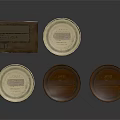 Round Metal Cans With Gold Lids And Brown Box On Dark Surface