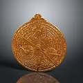 Ancient Golden Weapon With Circular Shape Intricate Carvings And Decorative Patterns