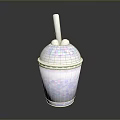 White Smoothie Cup With Colorful Speckles And Straw On Dark Shiny Surface