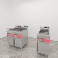 Two Silver Kitchen Fryers with Red Labels on Grey Floor and White Walls