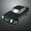 Vintage Green Sports Car With Rounded Body White Headlights And Silver Wheels