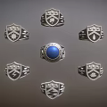 Stylish Emblem Design Rings With Central Blue Gemstone And Silver Settings