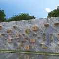 Wooden Shelves And Hooks For Daily Essentials On Gray Stone Wall With Trees And Pond Reflection