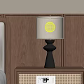 Black Table Lamp With Beige Fabric Shade On Wooden Bedside Table Against Wooden Wall Panel