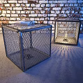 Cube Shaped Metal Mesh Floor Lamp On Sofa Side With Light Shadows And Brick Wall