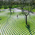 Garden Ornament With Grid Patterned Tiles Green Lawn And Trees For Walking