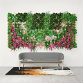 Lush Indoor Living Plant Wall With Green Foliage And Pink Flowers Above Sofa