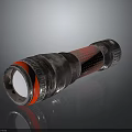 Shiny Metallic Cylindrical Object With Red Ring And Textured Reflective Surface