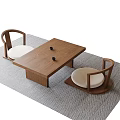 Minimalist Wooden Tea Table With Black Teacups And Upholstered Chairs On Gray Woven Rug