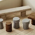 Light Colored Stone Bench And Wooden Stools On Indoor Wooden Floor