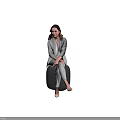 Elegant Woman in Gray Suit Set Sitting on Black Cube with Light Brown Background