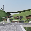 Hotel Building Surrounded By Green Hills And Waterfront Scenic Landscape With Curved Roads