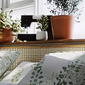 Home Balcony Interior With Natural Light Potted Plants On Windowsill Side Table And Decorative Items
