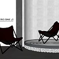 Two Black Leather Lounge Chairs With Metal Frames On Stylish Platform And Pebbles