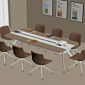 Modern Office Meeting Space With Long Table Rolling Chairs And Wall Posters