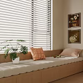 Cozy Bay Window Interior With Cushioned Seat Throw Pillows Green Plant And Wall Art