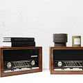Vintage Wooden Stereo Speakers With Decorative Books And Candles On Tabletop