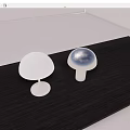 White And Silver Mushroom Shaped Table Lamps On Dark Wooden Surface