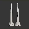 White Electric Toothbrushes With Base And Digital Display On Dark Surface 3d model