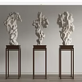 Three White Stone Sculptures On Dark Wooden Stands For Interior Display Decoration