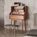 Wooden Dressing Table with Cosmetics Perfume Bottles and Green Cushioned Stool Near Plant