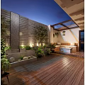 Serene Roof Garden With Tropical Plants Water Feature Wooden Deck And Cozy Seating Area