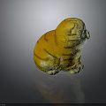 Yellow Orange Striped Cat Plush Toy With Green Eyes Sitting On Black Background With Reflection