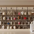 Various Ceramic Wares Display On Wall Shelves With Colorful Patterns And Decorative Shapes