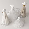 Elegant White and Gold Wedding Dresses with Lace Details on Mannequin