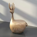 Wooden Deer Shaped Single Chair On Gray Table With White Wall Background And Sunlight Shadows
