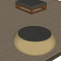Modern Wooden Coffee Table With Gray Cushion And Beige Round Textured Surface