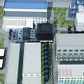 Aerial View Of Industrial Factory Buildings With Various Roofs Conveyor Systems And Green Lawns