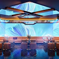 Modern KTV Interior Design With Blue Wall Decor Comfortable Sofa Seating And Ceiling Lighting