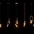 Multiple Modern Pendant Lights With Stylish Designs Glowing In Dark Background