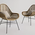 Modern Wicker Leisure Chairs With Black Metal Legs And Light Colored Cushions
