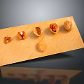 Whole And Opened Nuts Arranged On A Wooden Board With Gray Background