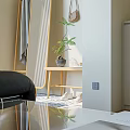 Modern Living Dining Room Interior With Black Leather Sofa Wooden Bookshelf And Green Plants