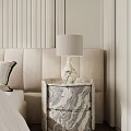 Elegant Marble Texture Bedside Table With White Shade Lamp Next To Beige Upholstered Bed