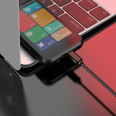 Sleek Laptop And Smartphone Connected With Charging Cable On Desk 3d model