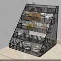 Organized Spice Jars with Black Multi Tiered Wire Rack on Light Colored Kitchen Countertop