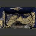 Old Blue Sofa With Torn Fabric Exposing Yellow Stuffing And Worn Edges