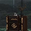 Classic Wooden Bedside Table with Intricate Gold Accents Topped with Ceramic Vase and Tea Cups