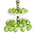 Fresh Green Fruits On Two Tiered White Tray With Golden Stand